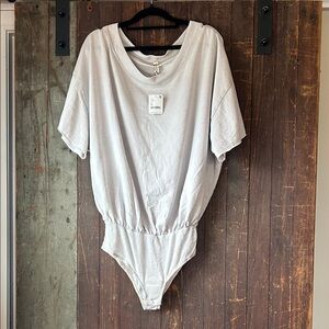 Not for sale-  Reserved 
FP Movement by Free People Soft Gray Bodysuit